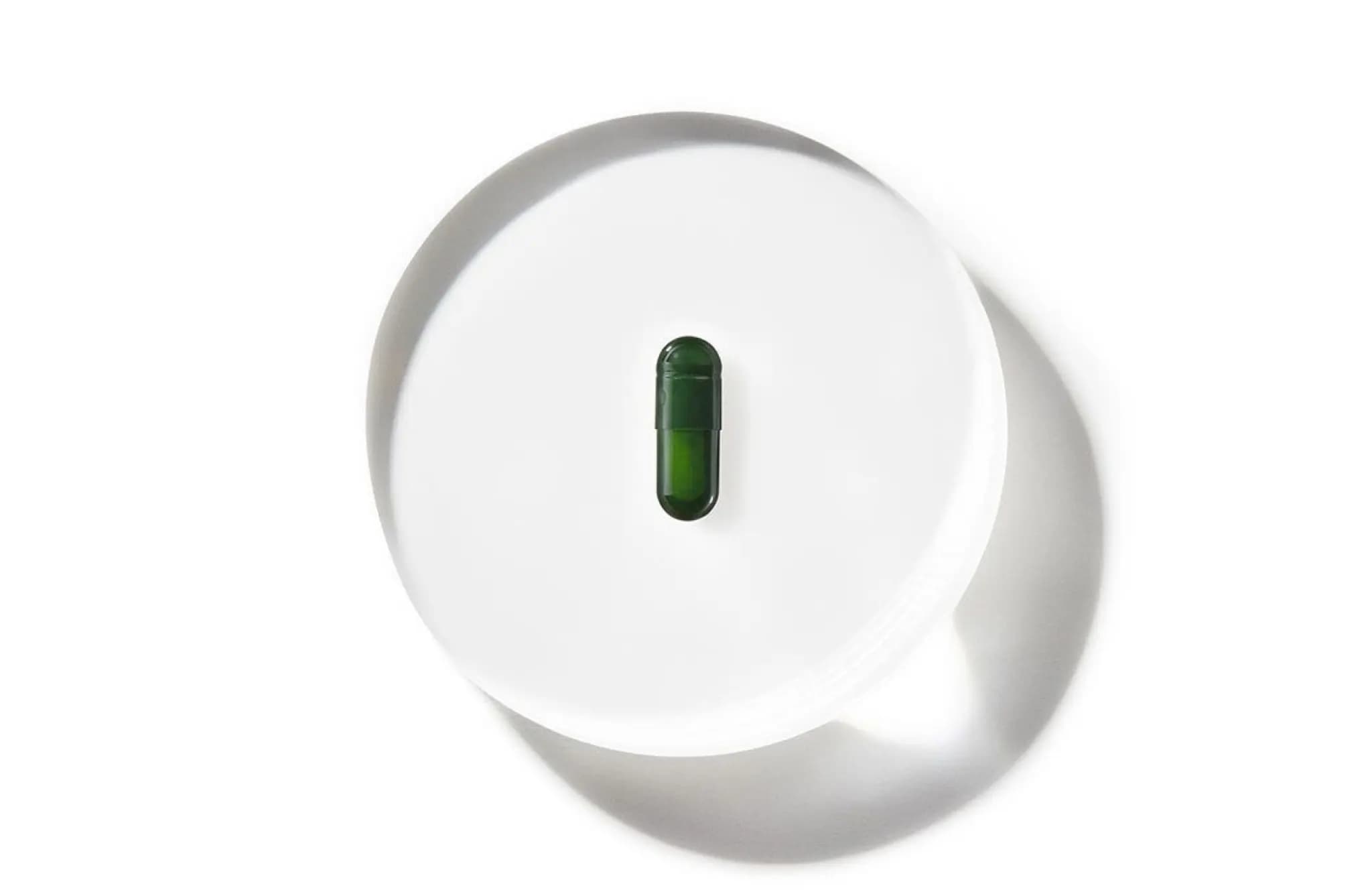 Seed ds-01 capsule on top of magnified glass